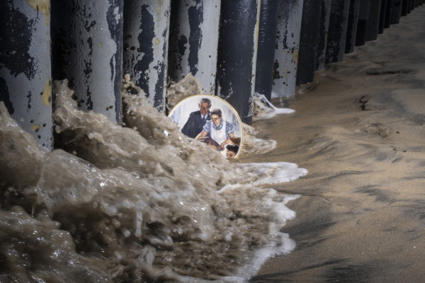 A plate with famous Norman Rockwells´ painting of Thanksgiving is placed by the Mexican side of the wall in Tijuana beach. From April to October 2018, the Trump administration reinforced the border control and caused many families to remain separated in detention centers.