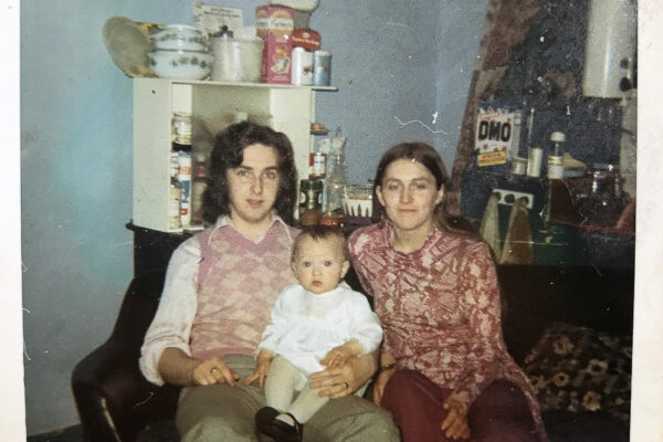 Kirsty Mackay pictured with her parents in Maryhill, 1971. ‘This was the first flat I lived in. It was a victorian tenement flat called a “room and kitchen”. We had this room and one bedroom, the toilet was on the landing shared with the neighbours.’ Courtesy of Kirsty Mackay