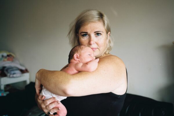 Debbie holds her newborn baby,
Anderston, Glasgow. That first journey
home from the hospital, depending on
which area home is, has a profound
impact on health, well being and life
expectancy.